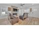 Modern living room with a stacked stone fireplace and sleek furnishings at 293 Blanche Cir, Rock Hill, SC 29730