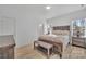 Calming main bedroom featuring wood furnishings, neutral décor, and ample natural light at 293 Blanche Cir, Rock Hill, SC 29730