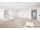 Bedroom with neutral carpet, attached bathroom, walk-in closet, and ample space at 338 Shinnville Rd, Mooresville, NC 28115