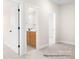 Hallway with multiple doorways leading to different rooms, showcasing the layout of the home at 338 Shinnville Rd, Mooresville, NC 28115