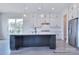 Bright kitchen showcasing stainless steel appliances, custom cabinetry, and a central island at 338 Shinnville Rd, Mooresville, NC 28115