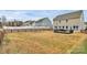 Expansive backyard with a wooden fence, a deck and lush grass at 4118 Caldwell Ridge Pkwy, Charlotte, NC 28213
