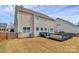 Lovely backyard featuring a private deck, well maintained lawn and beautiful plantings at 4118 Caldwell Ridge Pkwy, Charlotte, NC 28213