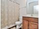 Well-maintained bathroom with a vanity, a toilet, and a shower with a patterned curtain at 4118 Caldwell Ridge Pkwy, Charlotte, NC 28213