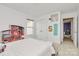 Bright bedroom featuring a cozy bed, a cute dollhouse, and ample natural light from a large window at 4118 Caldwell Ridge Pkwy, Charlotte, NC 28213