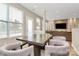 Bright dining area adjacent to the living room, featuring a modern table with seating for six at 4118 Caldwell Ridge Pkwy, Charlotte, NC 28213