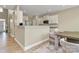Inviting dining area adjacent to the kitchen, features a stylish table and comfortable upholstered chairs at 4118 Caldwell Ridge Pkwy, Charlotte, NC 28213