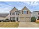 Inviting two-story home with double garage and well-manicured front yard at 4118 Caldwell Ridge Pkwy, Charlotte, NC 28213