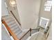 Grand foyer featuring a staircase with wood railings and a view of the front door at 4118 Caldwell Ridge Pkwy, Charlotte, NC 28213