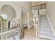 Bright foyer with staircase, hardwood floors, and decorative mirror at 4118 Caldwell Ridge Pkwy, Charlotte, NC 28213