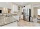Bright kitchen featuring white cabinets, stainless steel appliances, and granite countertops at 4118 Caldwell Ridge Pkwy, Charlotte, NC 28213