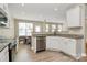 Bright kitchen featuring white cabinetry, stainless steel appliances, and granite countertops at 4118 Caldwell Ridge Pkwy, Charlotte, NC 28213