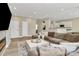 Open living space showcasing a sectional sofa and an electric fireplace with a large format TV above it at 4118 Caldwell Ridge Pkwy, Charlotte, NC 28213