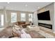 Spacious living room with large sectional sofa and built-in fireplace at 4118 Caldwell Ridge Pkwy, Charlotte, NC 28213