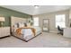 Serene main bedroom with soft green accent wall, a large bed, and ample natural light at 4118 Caldwell Ridge Pkwy, Charlotte, NC 28213