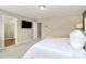 Bright main bedroom with a glimpse of the attached bathroom, featuring TV and ample space at 4118 Caldwell Ridge Pkwy, Charlotte, NC 28213