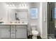 Bright bathroom featuring a double sink vanity, modern fixtures, and a sleek glass-enclosed shower at 5010 Arbordale Way # 5, Mount Holly, NC 28120
