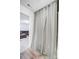 Bathroom with tub/shower combo, and a gray curtain dividing it from an adjacent, carpeted living room at 5010 Arbordale Way # 5, Mount Holly, NC 28120