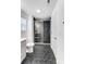 Beautiful bathroom showcasing black tile floors, a glass shower and neutral color palette at 5010 Arbordale Way # 5, Mount Holly, NC 28120