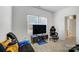 Comfortable living area with gray floors, a flat-screen TV, and natural light from the windows at 5010 Arbordale Way # 5, Mount Holly, NC 28120