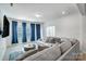 Bright living room featuring a large sectional sofa, round coffee table, and plenty of natural light from windows at 5010 Arbordale Way # 5, Mount Holly, NC 28120