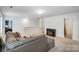 Upstairs living room featuring plush carpeting, a modern fireplace, and open floor plan at 5010 Arbordale Way # 5, Mount Holly, NC 28120