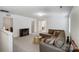 Spacious living room with neutral carpet, a large sectional sofa, and a cozy fireplace feature at 5010 Arbordale Way # 5, Mount Holly, NC 28120