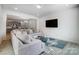 Open living space, seamlessly connecting the living room, dining area, and kitchen with modern decor at 5010 Arbordale Way # 5, Mount Holly, NC 28120