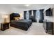 Elegant main bedroom with neutral carpet, luxurious bed, and matching dark wood furniture at 5010 Arbordale Way # 5, Mount Holly, NC 28120