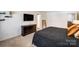 Comfortable bedroom with plush carpet, modern dresser, and plenty of natural light at 5010 Arbordale Way # 5, Mount Holly, NC 28120