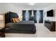 Serene bedroom with plush carpeting, large bed, and decorative bedside lamps at 5010 Arbordale Way # 5, Mount Holly, NC 28120