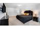 Bright main bedroom with plush carpeting, decorative lighting, and modern furniture at 5010 Arbordale Way # 5, Mount Holly, NC 28120