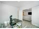 Well-lit office with modern desk, chair, and view to the living room, creating a flexible workspace at 5010 Arbordale Way # 5, Mount Holly, NC 28120
