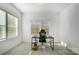 Bright, minimal office space filled with natural light, featuring a desk and simple black chair at 5010 Arbordale Way # 5, Mount Holly, NC 28120