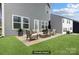 The spacious patio features an outdoor seating arrangement, perfect for relaxing and entertaining guests at 5010 Arbordale Way, Mount Holly, NC 28120