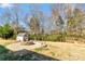 Spacious backyard featuring a fire pit, shed, and plenty of room for outdoor activities and enjoyment at 5020 Clover Hill Rd # 61, Indian Trail, NC 28079
