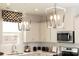 Stylish kitchen features granite countertops, stainless steel appliances, and pendant lighting at 7200 Hodges Meadow Ln, Charlotte, NC 28213