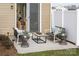 Outdoor patio with cozy seating, a coffee table, and easy access to the home's interior through a sliding glass door at 7200 Hodges Meadow Ln, Charlotte, NC 28213