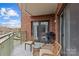 Spacious balcony with outdoor seating and a grill, great for entertaining or relaxing outdoors at 721 Governor Morrison St # 408, Charlotte, NC 28211