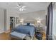 Well-lit bedroom with a walk-in closet, soft lighting, and bedside tables at 721 Governor Morrison St # 408, Charlotte, NC 28211