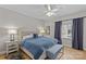 Comfortable bedroom with a queen-size bed, stylish bench, and soft lighting for a relaxing ambiance at 721 Governor Morrison St # 408, Charlotte, NC 28211