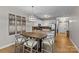 Modern dining area with a large table, stylish seating, and contemporary lighting at 721 Governor Morrison St # 408, Charlotte, NC 28211