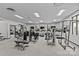 Well-equipped gym with modern exercise machines, large windows, and ample space for workouts at 721 Governor Morrison St # 408, Charlotte, NC 28211