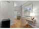 Hallway with hardwood flooring, a desk, and neutral paint that showcases a tranquil living space at 721 Governor Morrison St # 408, Charlotte, NC 28211