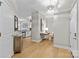 Inviting hallway with hardwood floors, leading to kitchen and living spaces that promotes seamless flow at 721 Governor Morrison St # 408, Charlotte, NC 28211