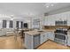 Modern kitchen features stainless steel appliances, white cabinets, and a beautiful open-concept layout at 721 Governor Morrison St # 408, Charlotte, NC 28211