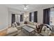 Cozy living room features a large sectional sofa, modern coffee table, and neutral decor at 721 Governor Morrison St # 408, Charlotte, NC 28211