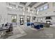 Lounge area with comfortable seating, fireplace, and large windows offering plenty of natural light at 721 Governor Morrison St # 408, Charlotte, NC 28211