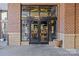Italian restaurant with double glass door, brick facade and outdoor seating in a commercial area at 721 Governor Morrison St # 408, Charlotte, NC 28211