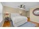 Cozy bedroom with hardwood floors, side tables, and overhead lighting at 7916 Wellston Dr, Charlotte, NC 28210